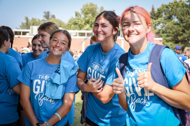 three female students outside on the Dakota State campus